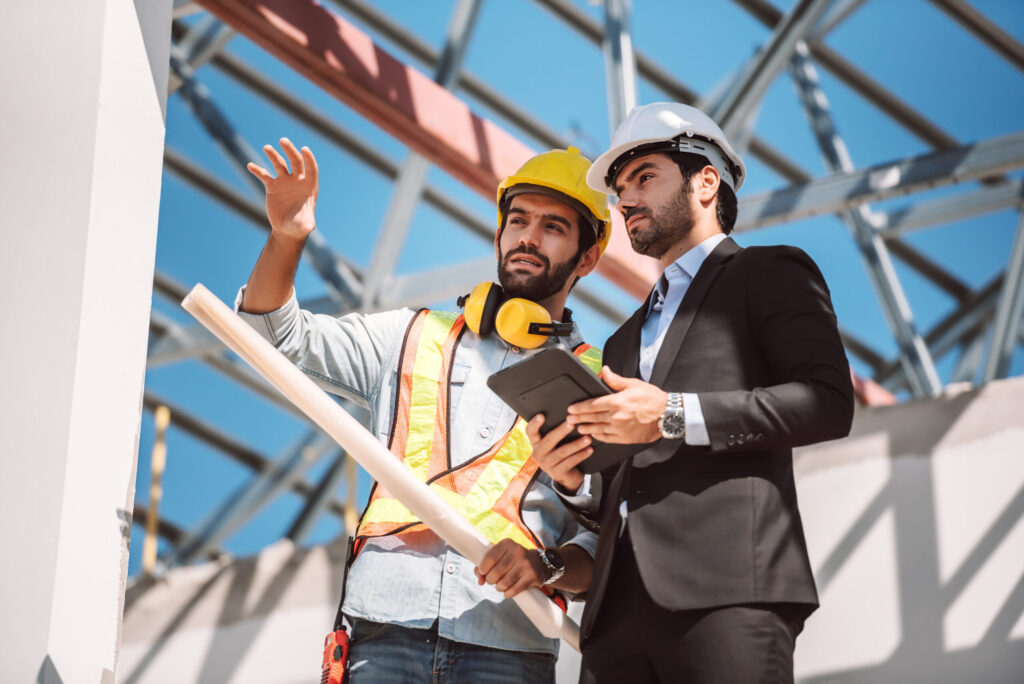 Scene shows collaboration and planning in the construction process.